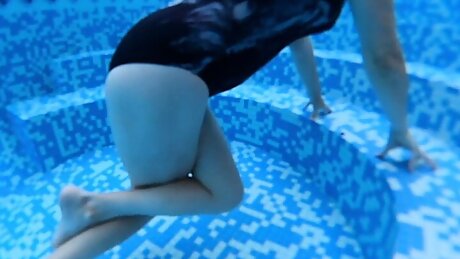 Crossed legs orgasm in outdoors pool