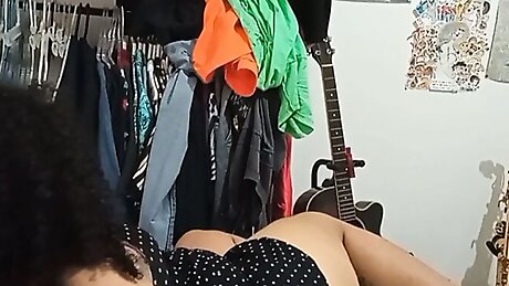 cleaning girl while she cleans the room and folds and hangs the clothes