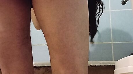 Milf with naked hairy ass washing her hair.