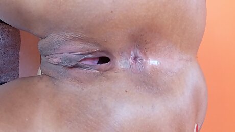 Black slut in white lingerie masturbating and playing with butt plug anal