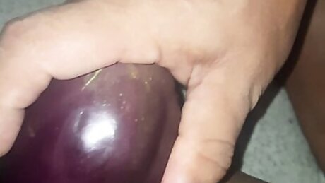Rosni is fingering & inserting Brinjal in her hot pussy.