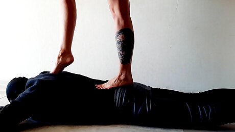Foot mat for Dominatrix Nika. Trampling the body of a slave.