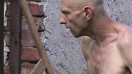 Old man toying teen girl outdoors