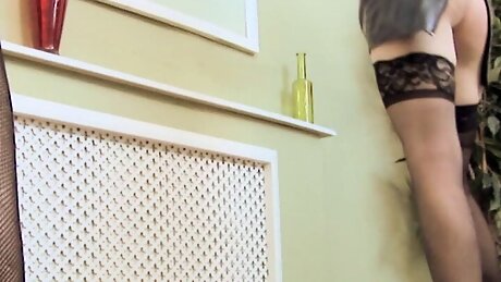 MILF lesbo shoves a glass dildo into hot blonde's hole