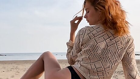 Young sexy girl having fun on sandy beach