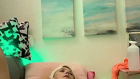 Laying on the couch naked playing with Kitty